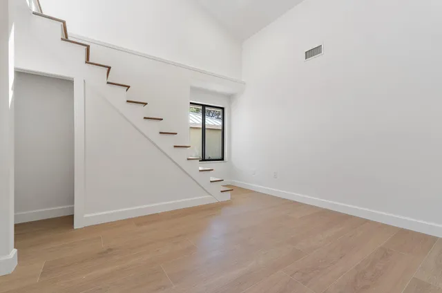 a view of a house with backyard and porch
