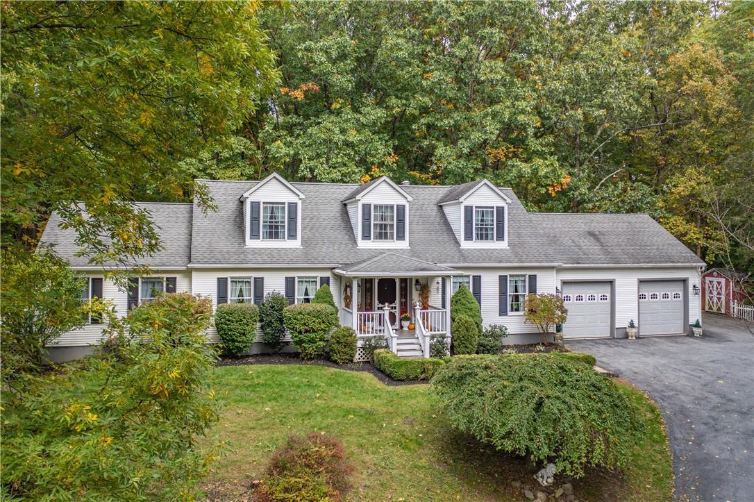 88 Baxter Road Red Hook, NY 12571 - Photo 1 of 1 a front view of a house with a yard and trees