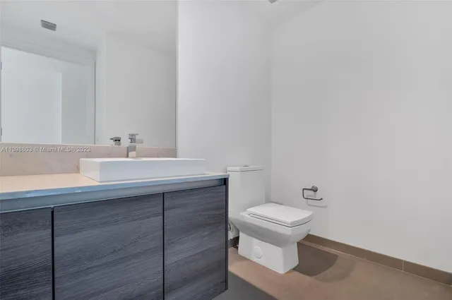 a bathroom with a sink and a toilet