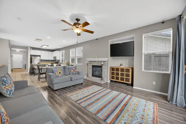 a view of a house with a yard and tree s