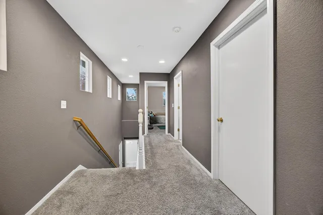 a bedroom with furniture and a chandelier