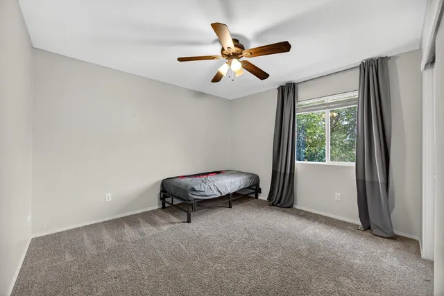 a view of a house with a yard porch and sitting area