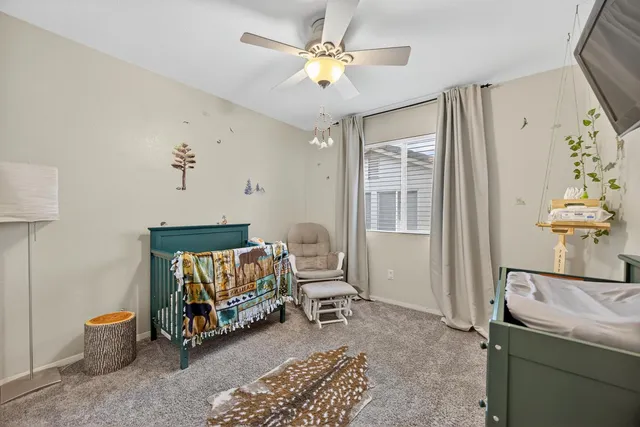 a view of a backyard with wooden fence