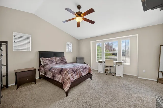 a view of a house with backyard porch and sitting area