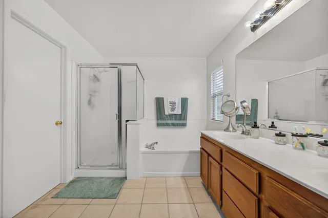 a front view of a house with a garden and porch