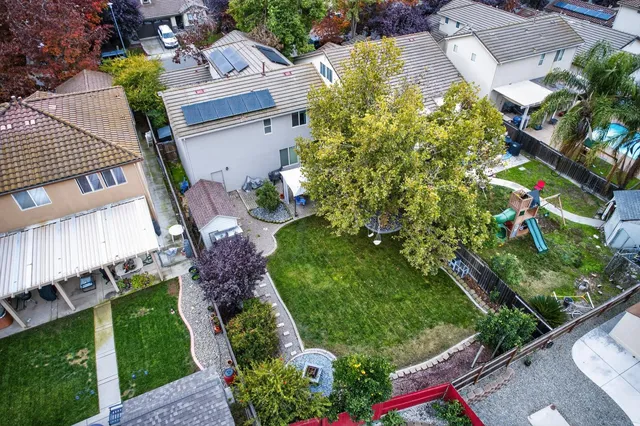 an aerial view of residential house with outdoor space and street view