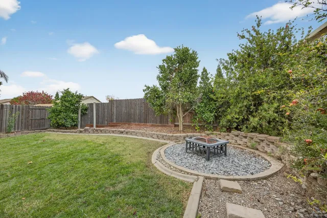 a view of an chairs and tables in the backyard