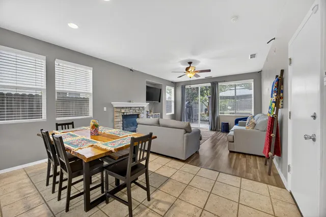 a view of a dining room with furniture and a kitchen
