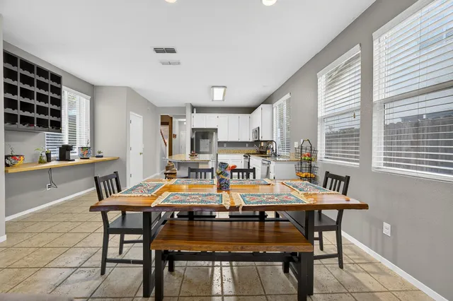a kitchen with stainless steel appliances a refrigerator and a stove top oven