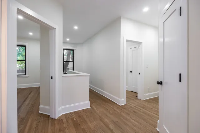 a bathroom with a bathtub shower sink vanity and toilet