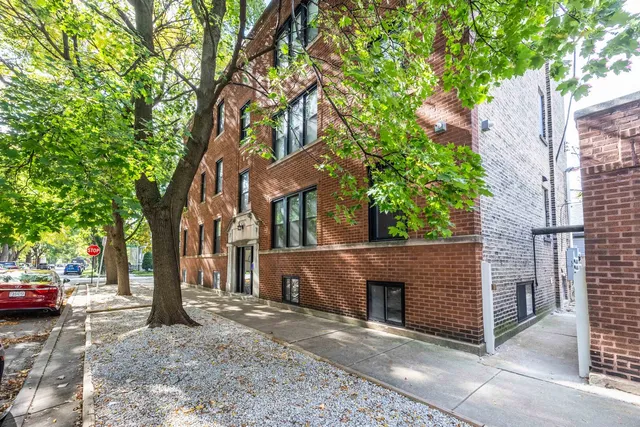 a view of a street with some trees on both side of it