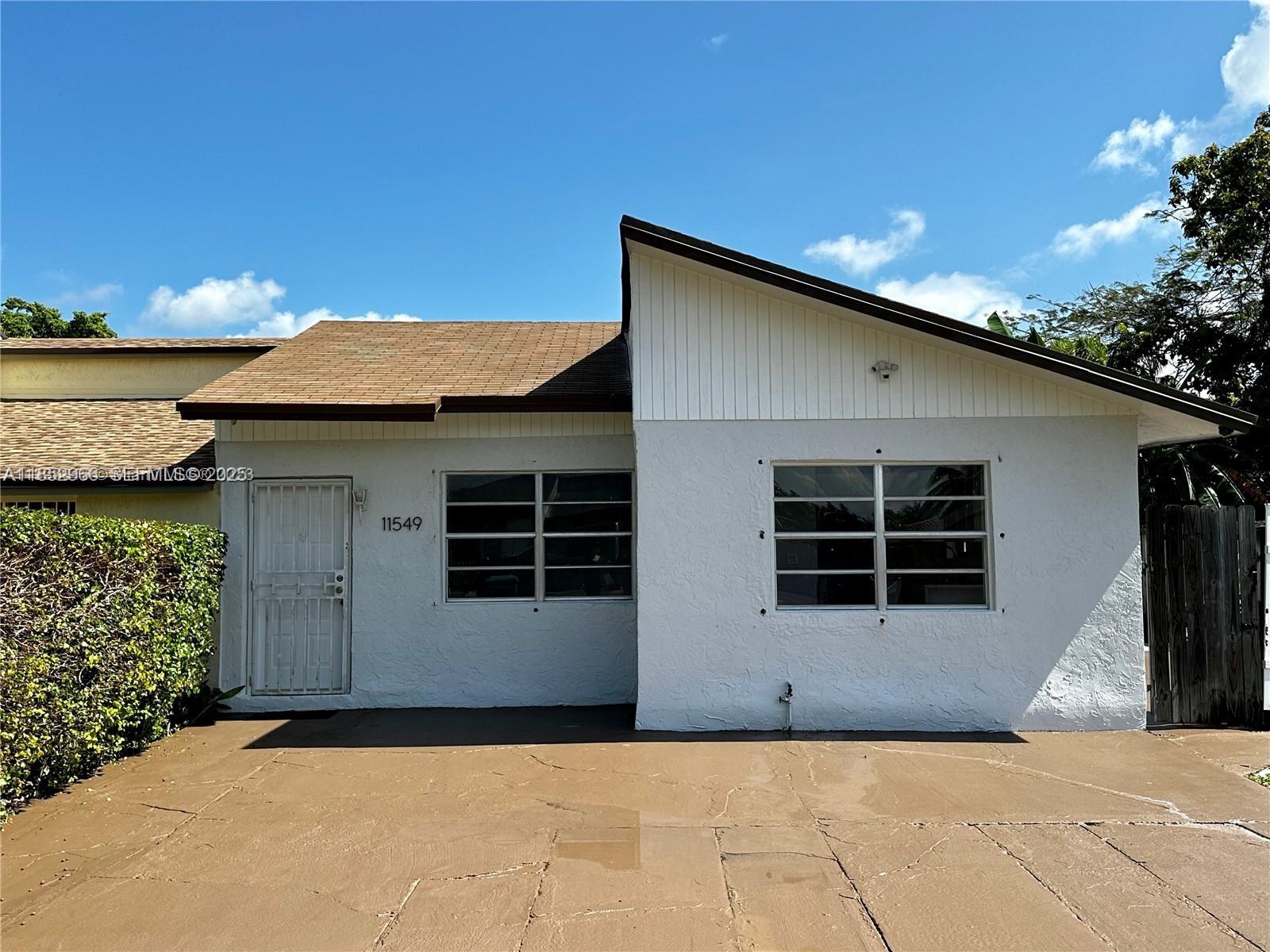 a house with trees in the background