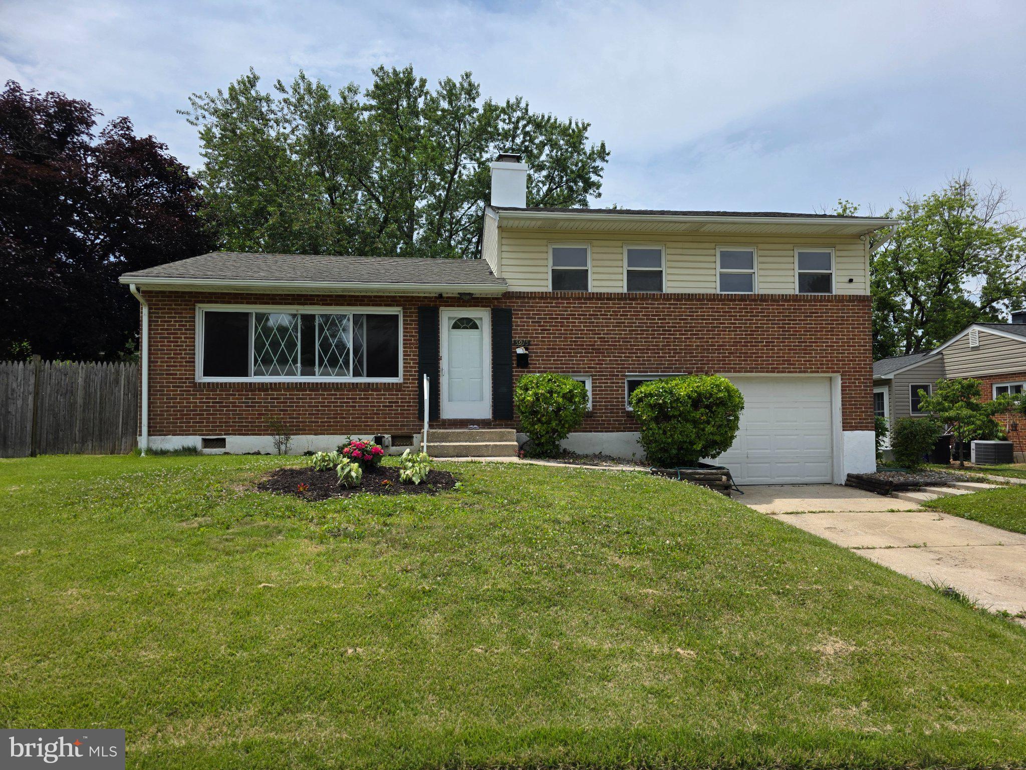 5915 Charnwood Road Catonsville, MD 21228 - Photo 1 of 21 Charming brick home with lush greenery.