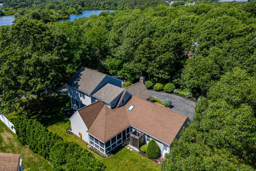 132 Goose Point Road Centerville, MA 02601 - Photo 54 of 54 an aerial view of a house with a yard and lake view