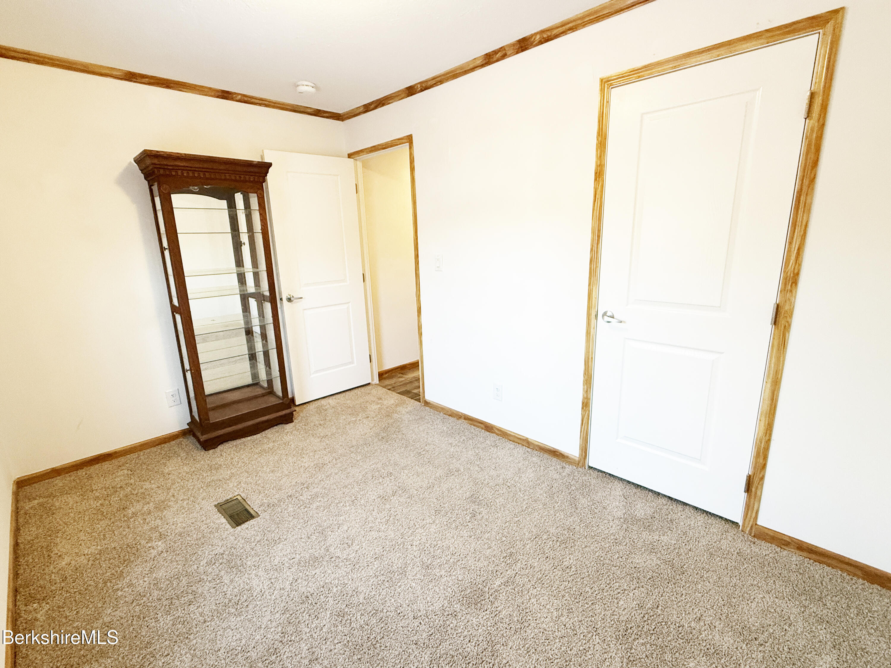 405 Pittsfield Road, Unit A6 Lenox, MA 01240 - Photo 12 of 17 a view of an empty room with a window