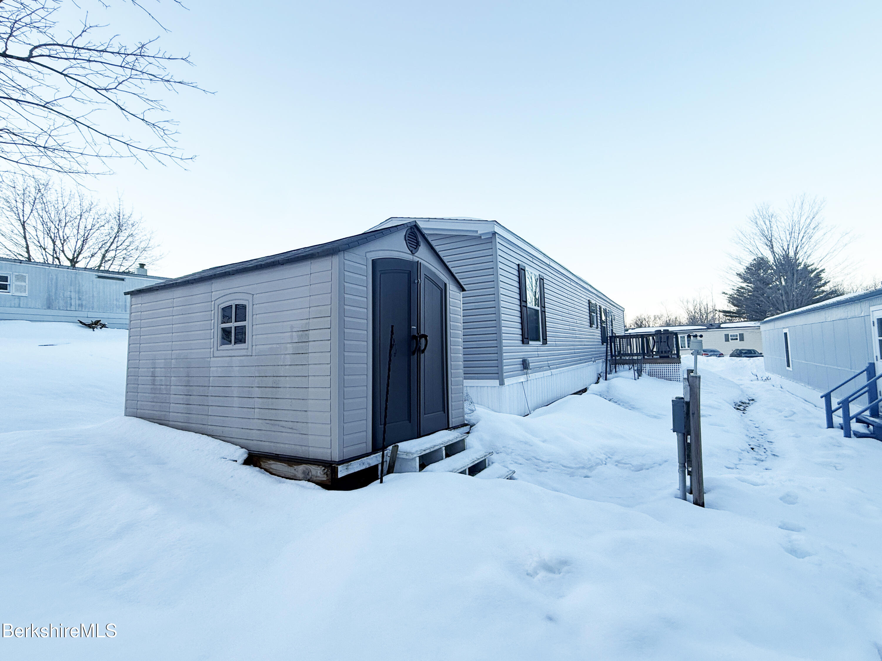 405 Pittsfield Road, Unit A6 Lenox, MA 01240 - Photo 17 of 17 a view of a house with a backyard