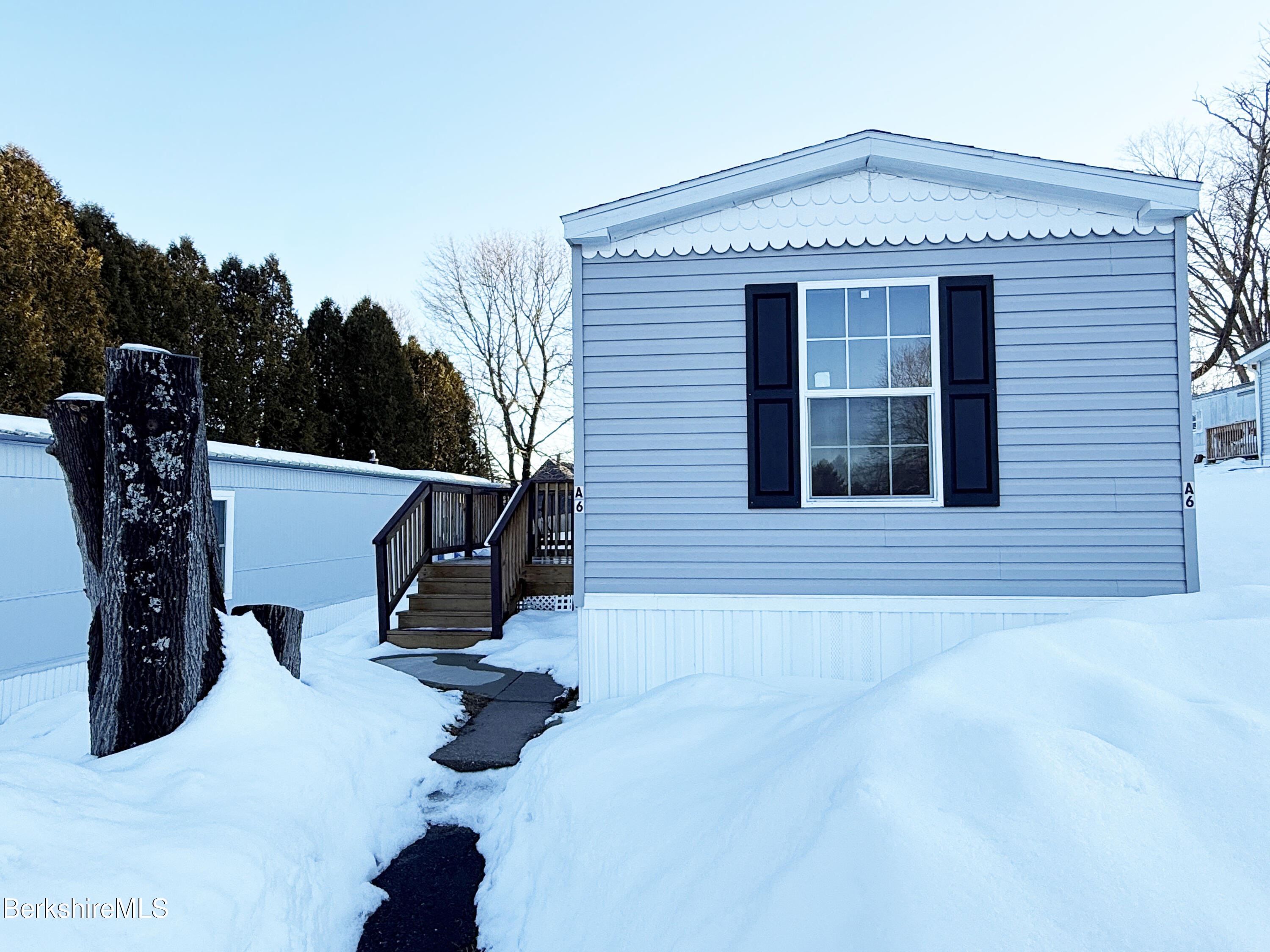 405 Pittsfield Road, Unit A6 Lenox, MA 01240 - Photo 2 of 17 a front view of a house with patio