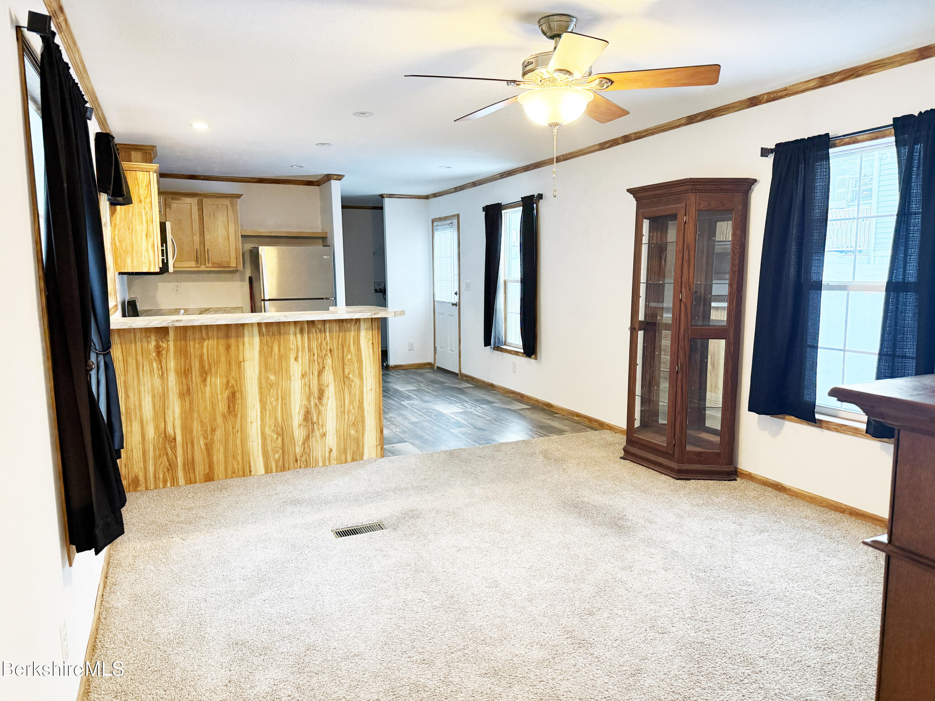 405 Pittsfield Road, Unit A6 Lenox, MA 01240 - Photo 5 of 17 a view of an empty room with a window