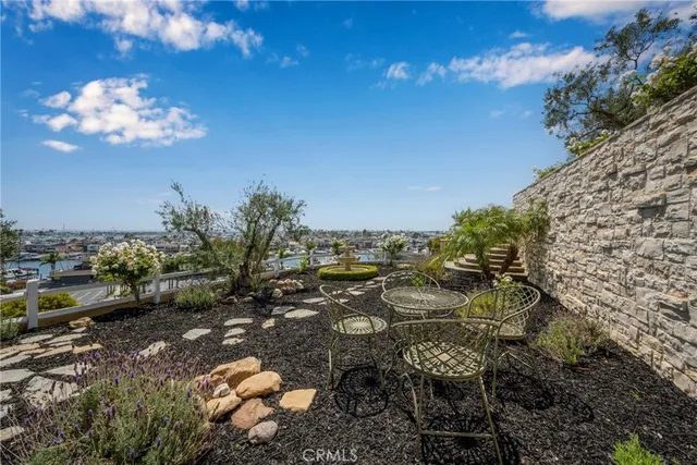 a view of a backyard with swimming pool
