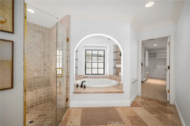 an empty room with closet and mirrors