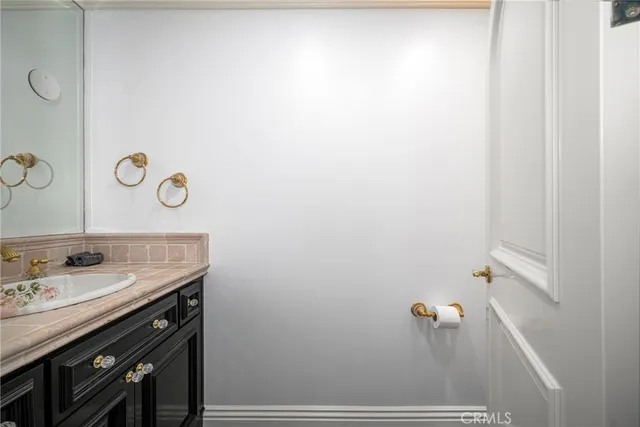a utility room with wooden floor washer and dryer
