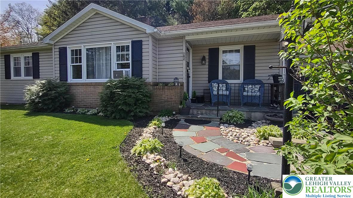 front view of a house with a yard