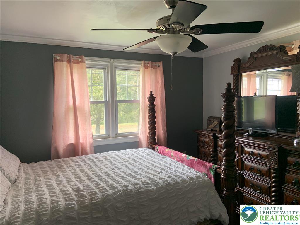 635 Silver Spring Boulevard Kunkletown, PA 18058 - Photo 28 of 34 a bedroom with a bed and a flat screen tv