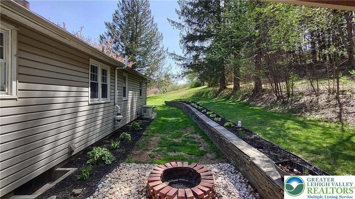 635 Silver Spring Boulevard Kunkletown, PA 18058 - Photo 6 of 34 a view of a yard with a large tree
