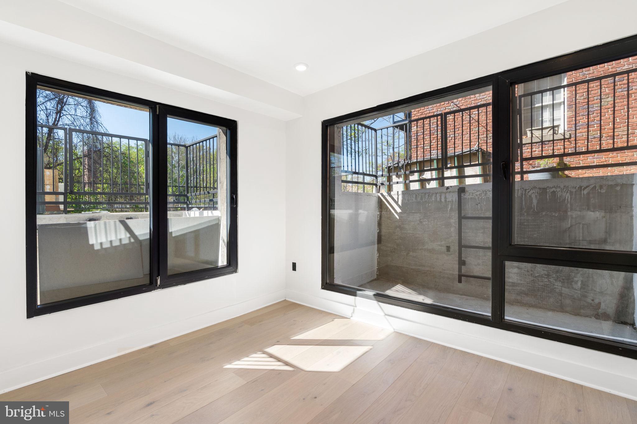 2504 41st Street Northwest, Unit 3 Washington, DC 20007 - Photo 17 of 24 a view of a room with large windows