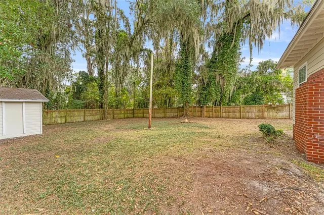 a backyard of a house with lots of green space