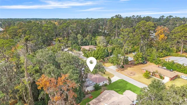 a view of a yard with table and chairs