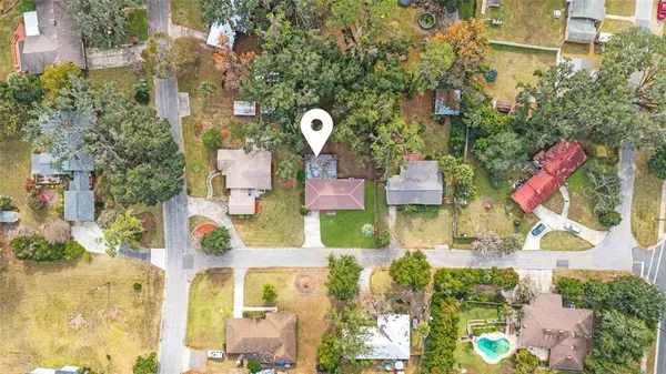 a aerial view of multi story residential apartment building with yard