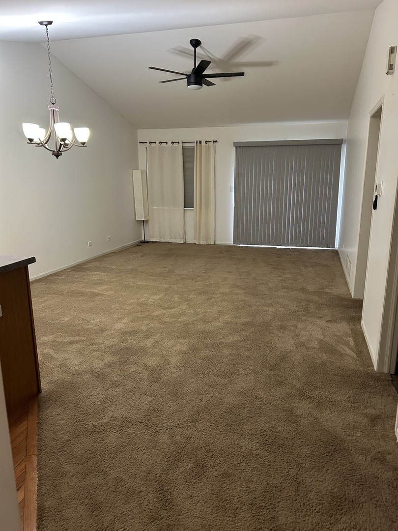 542 Timber Drive Harvard, IL 60033 - Photo 2 of 9 a view of a livingroom with a chandelier fan