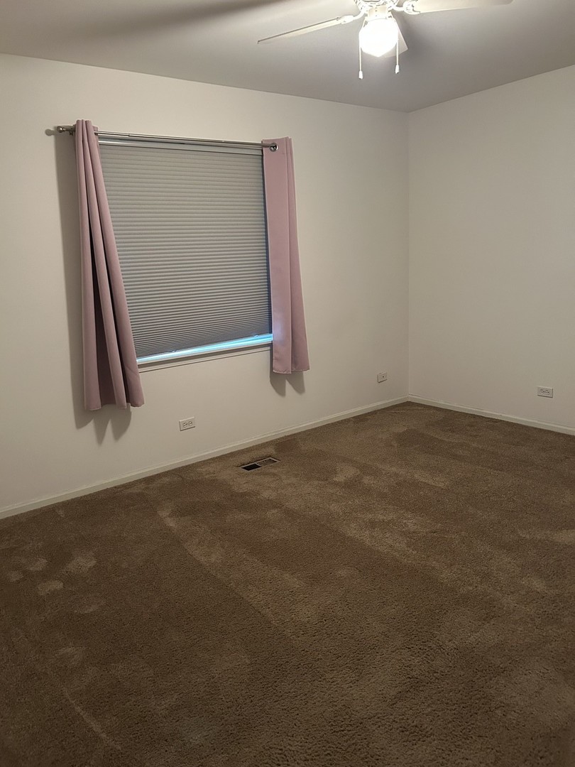 542 Timber Drive Harvard, IL 60033 - Photo 8 of 9 an empty room with windows