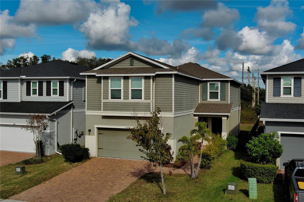 a front view of a house with a yard