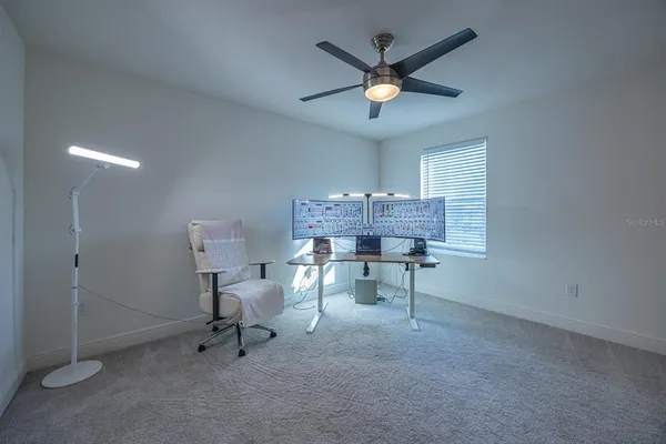 a view of a workspace with furniture