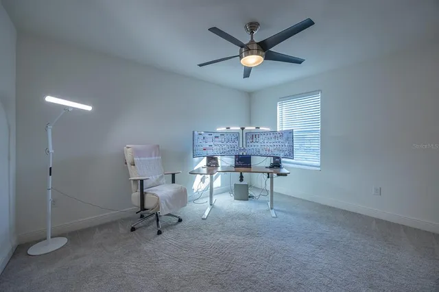 a view of a workspace with furniture