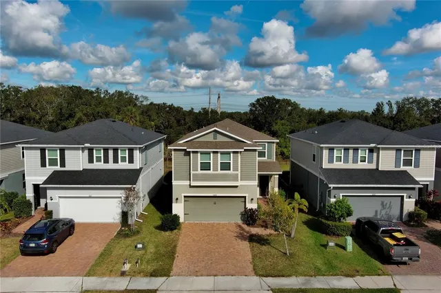 front view of a house with a yard