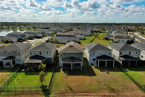 an aerial view of a house with a garden