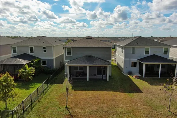 a front view of a house with yard and porch