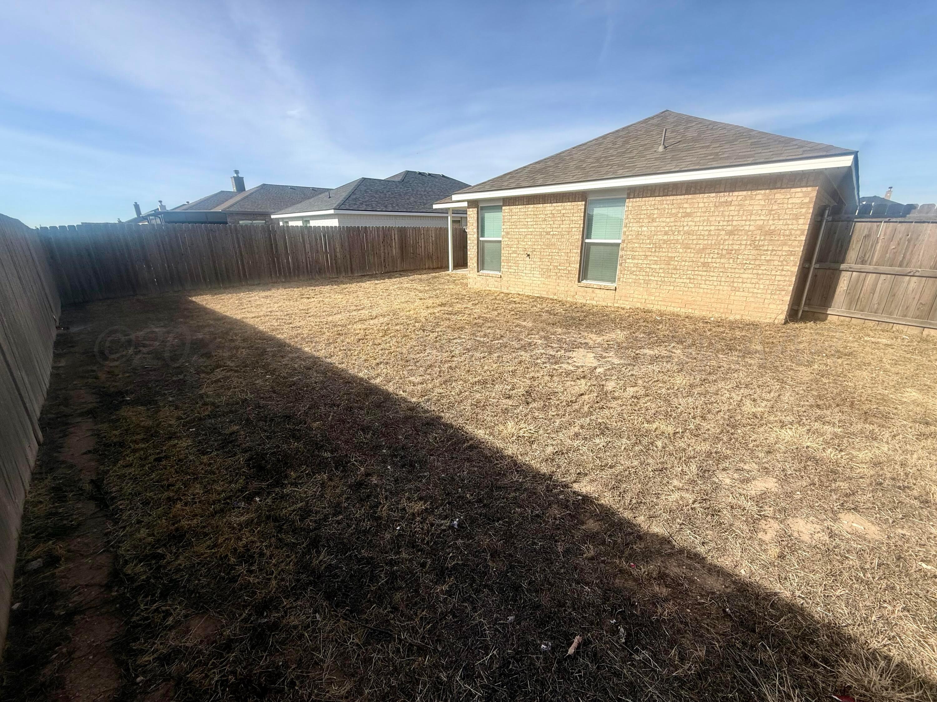1529 Lullwater Road Amarillo, TX 79118 - Photo 29 of 29 a front view of a house with a yard