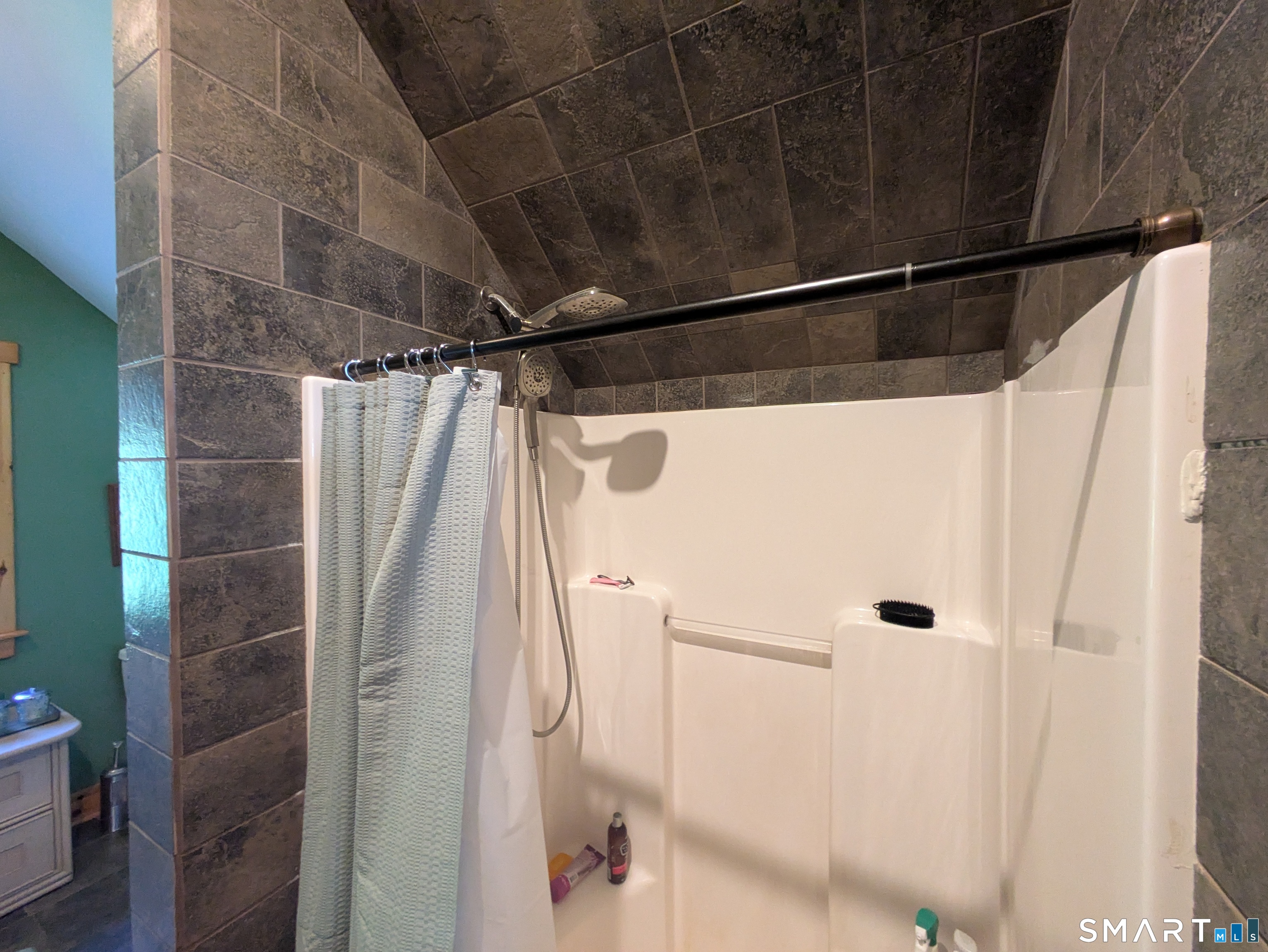 541 Benson Road Middlebury, CT 06762 - Photo 14 of 20 a bathroom with a shower and a glass door