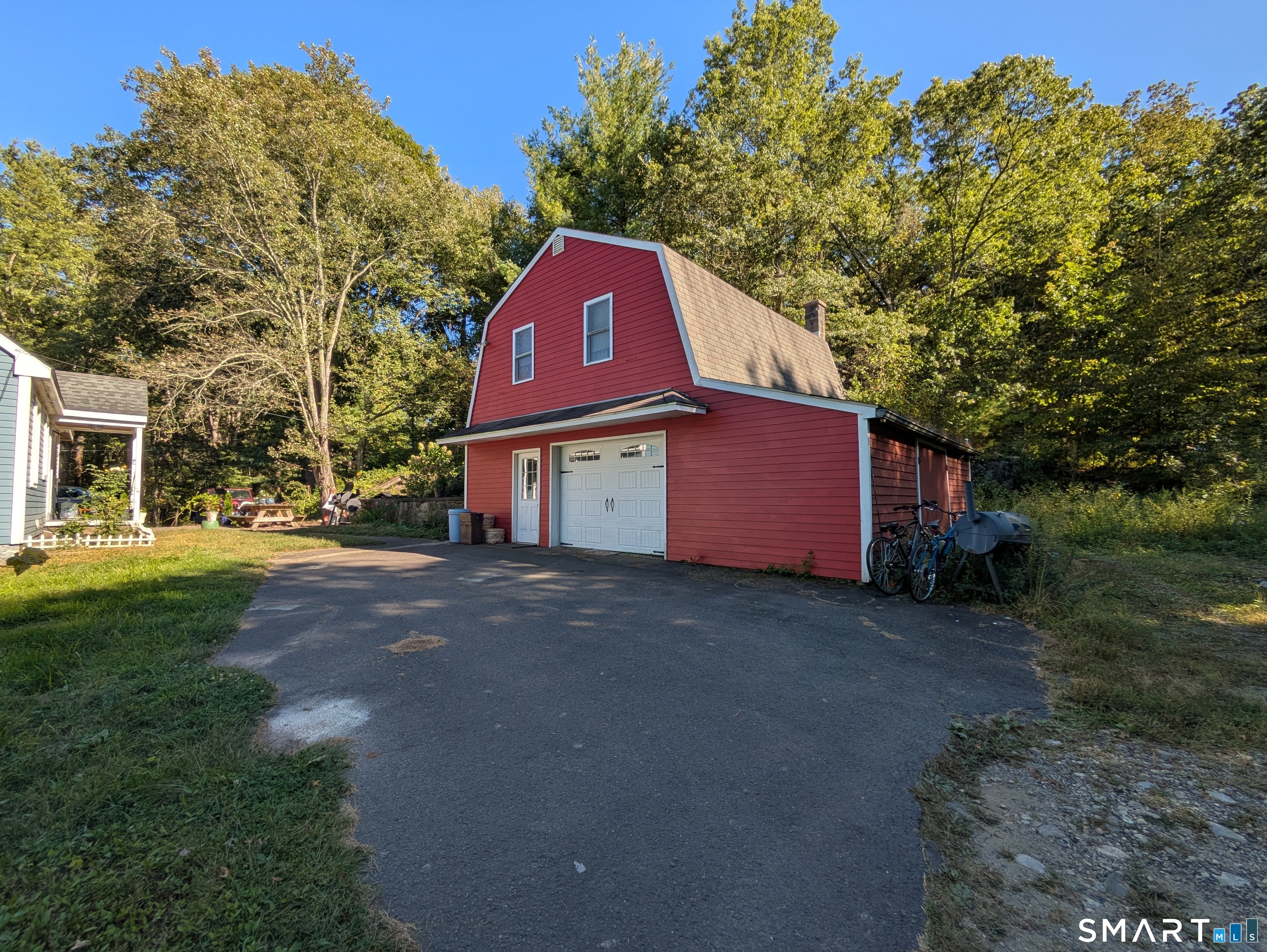 541 Benson Road Middlebury, CT 06762 - Photo 5 of 20 a view of a yard in front of a house with a large tree