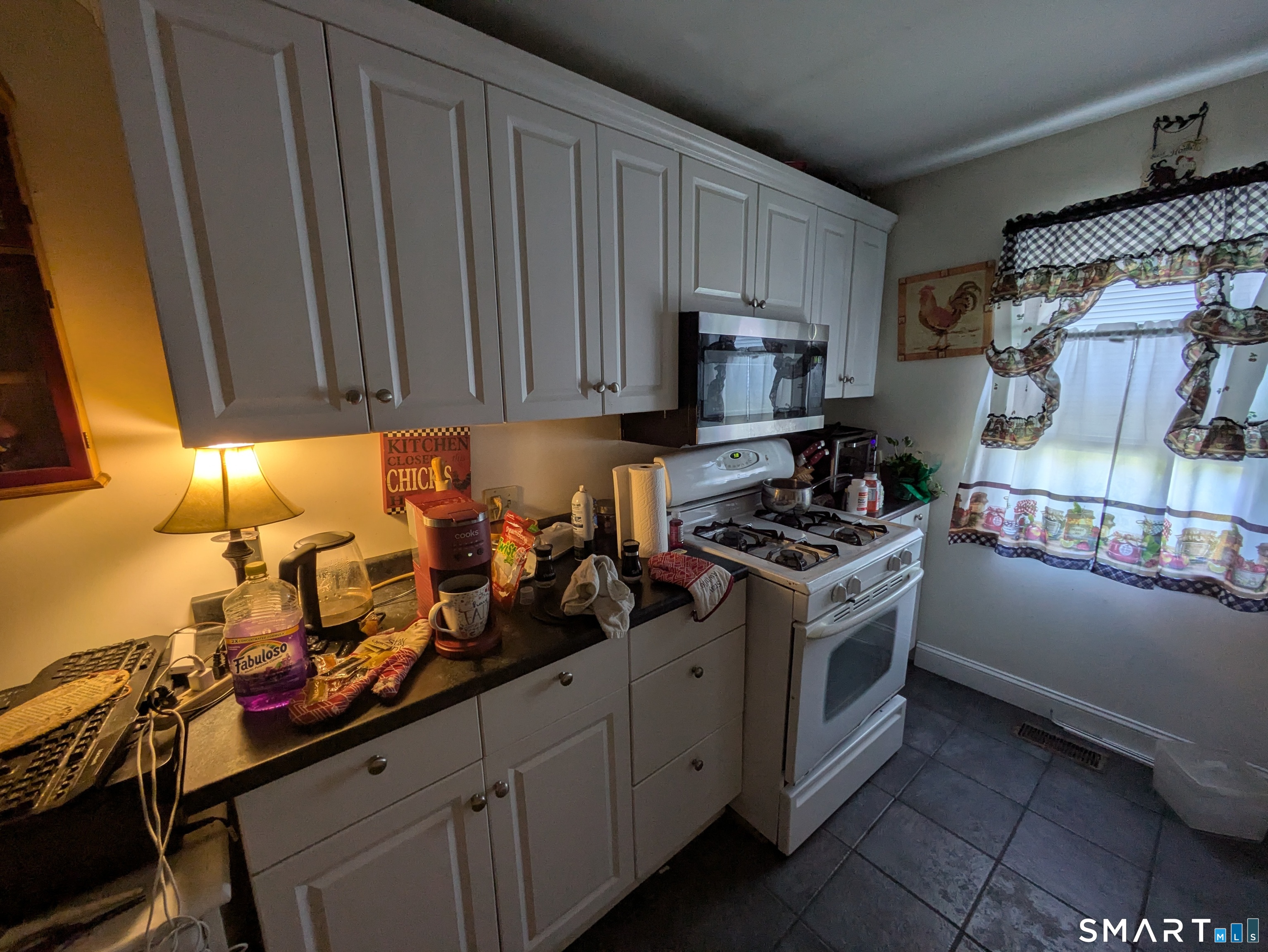 541 Benson Road Middlebury, CT 06762 - Photo 6 of 20 a kitchen with a stove and a refrigerator