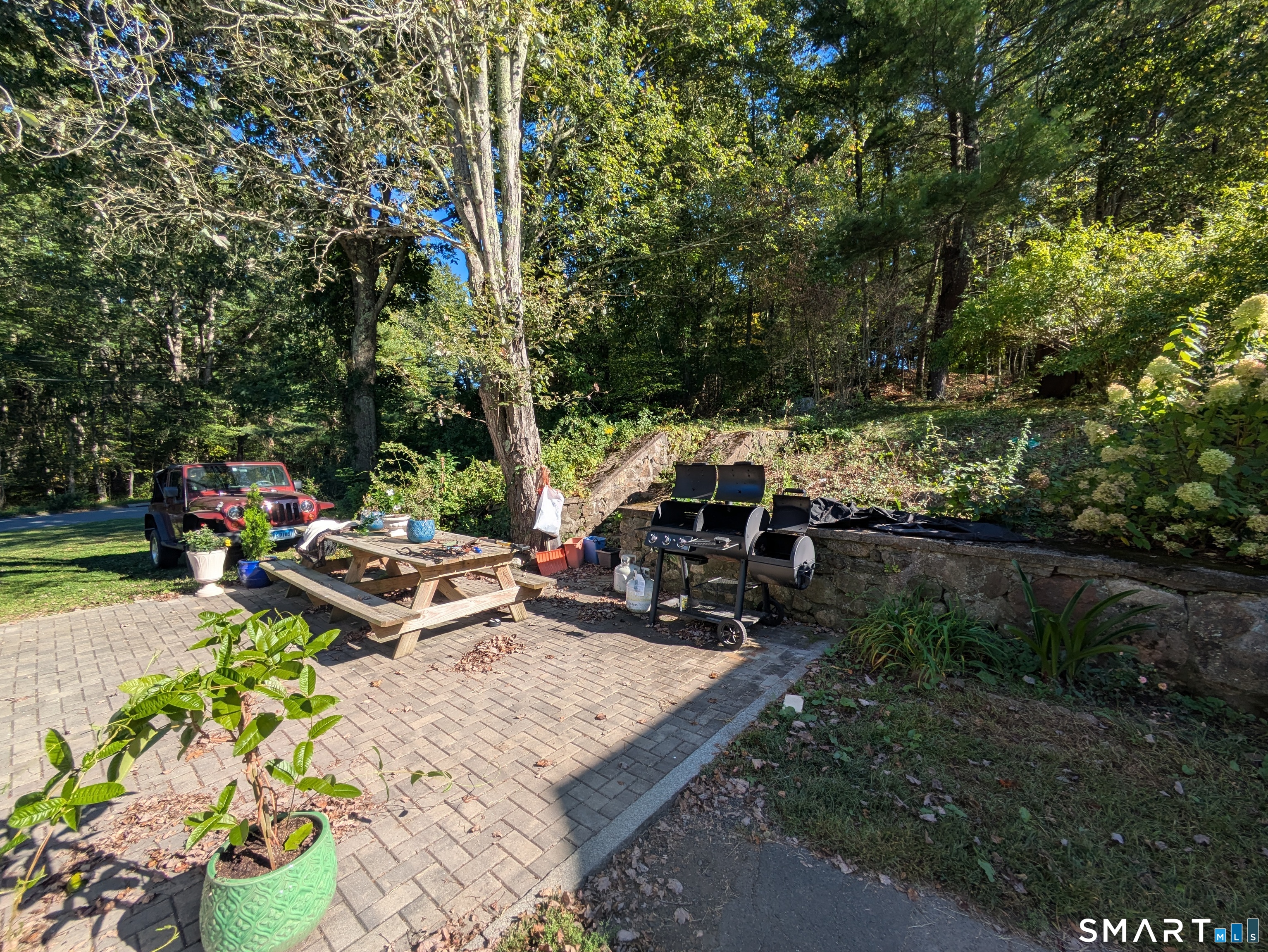 541 Benson Road Middlebury, CT 06762 - Photo 8 of 20 a view of a backyard with sitting area