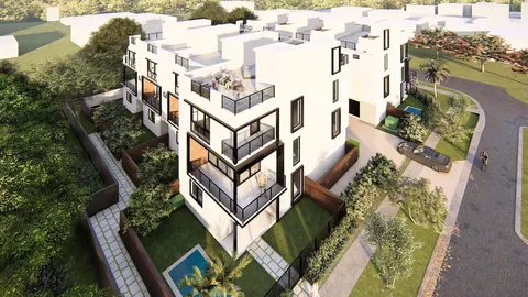 an aerial view of a house with swimming pool and outdoor seating