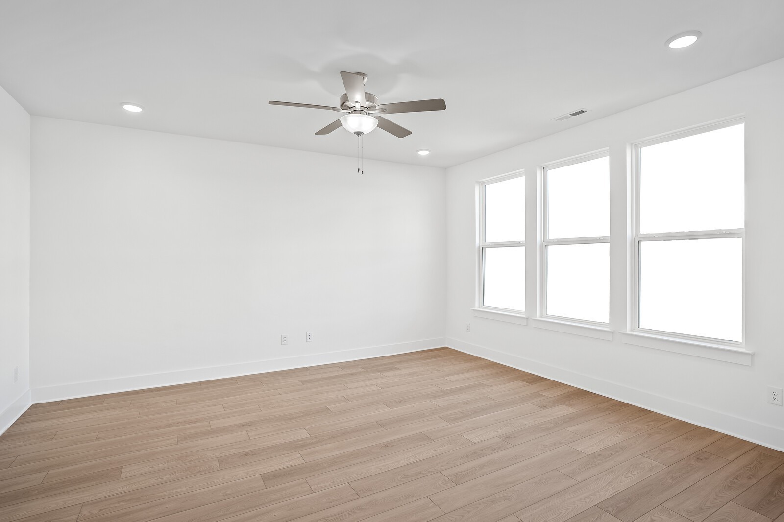 2155 Barnwood Road Gallatin, TN 37066 - Photo 16 of 51 an empty room with wooden floor fan and windows