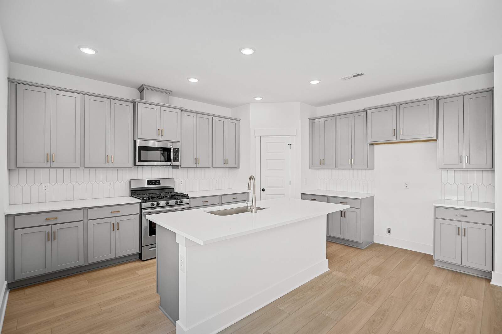 2155 Barnwood Road Gallatin, TN 37066 - Photo 20 of 51 a kitchen with white cabinets appliances and sink
