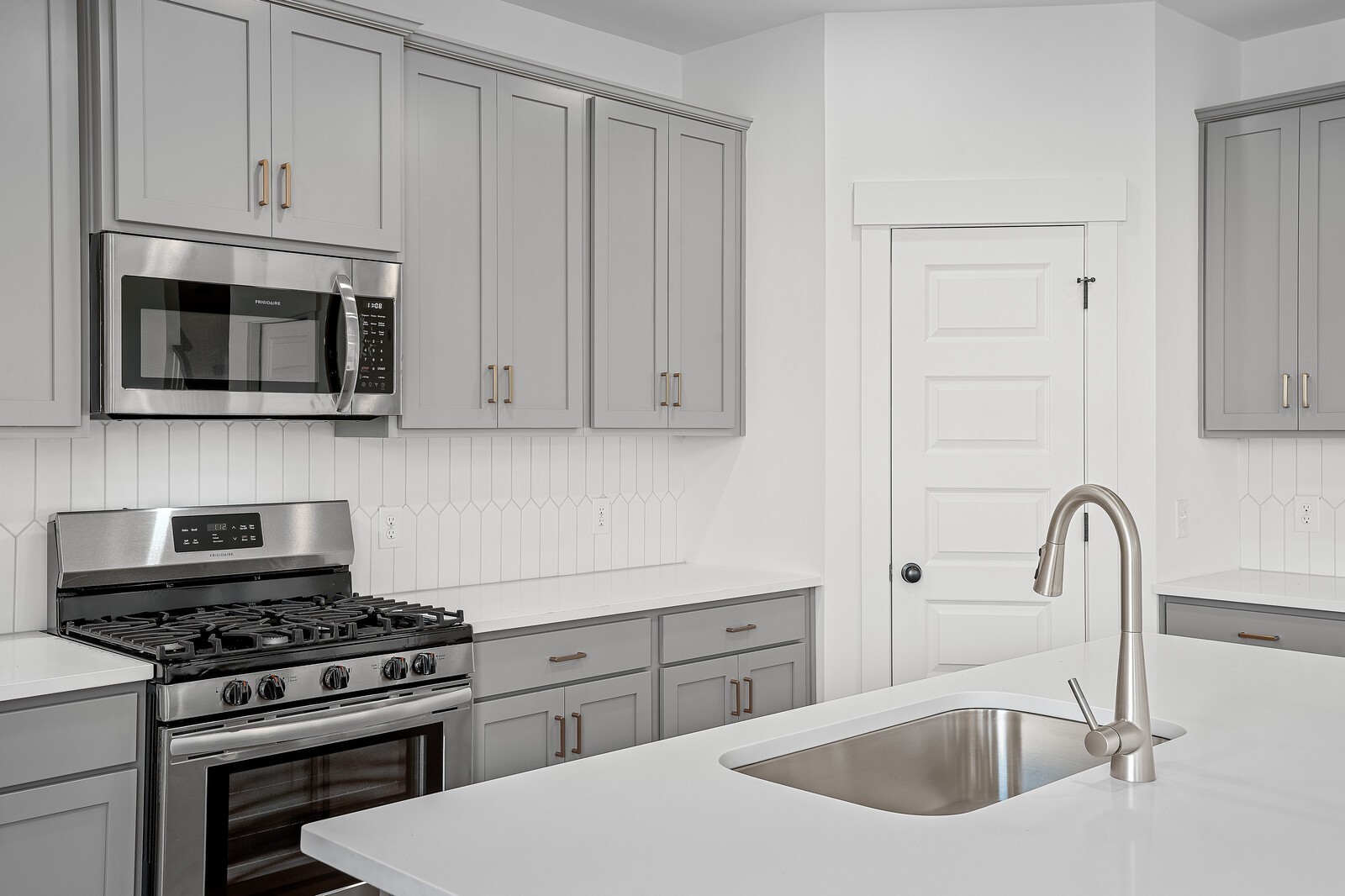 2155 Barnwood Road Gallatin, TN 37066 - Photo 21 of 51 a kitchen with stainless steel appliances granite countertop white cabinets a stove top oven and sink