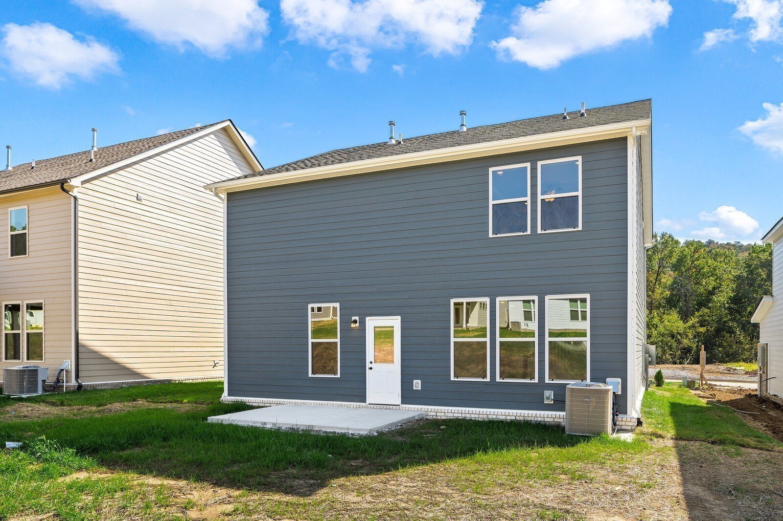 2155 Barnwood Road Gallatin, TN 37066 - Photo 36 of 51 a front view of a house with a yard and potted plants